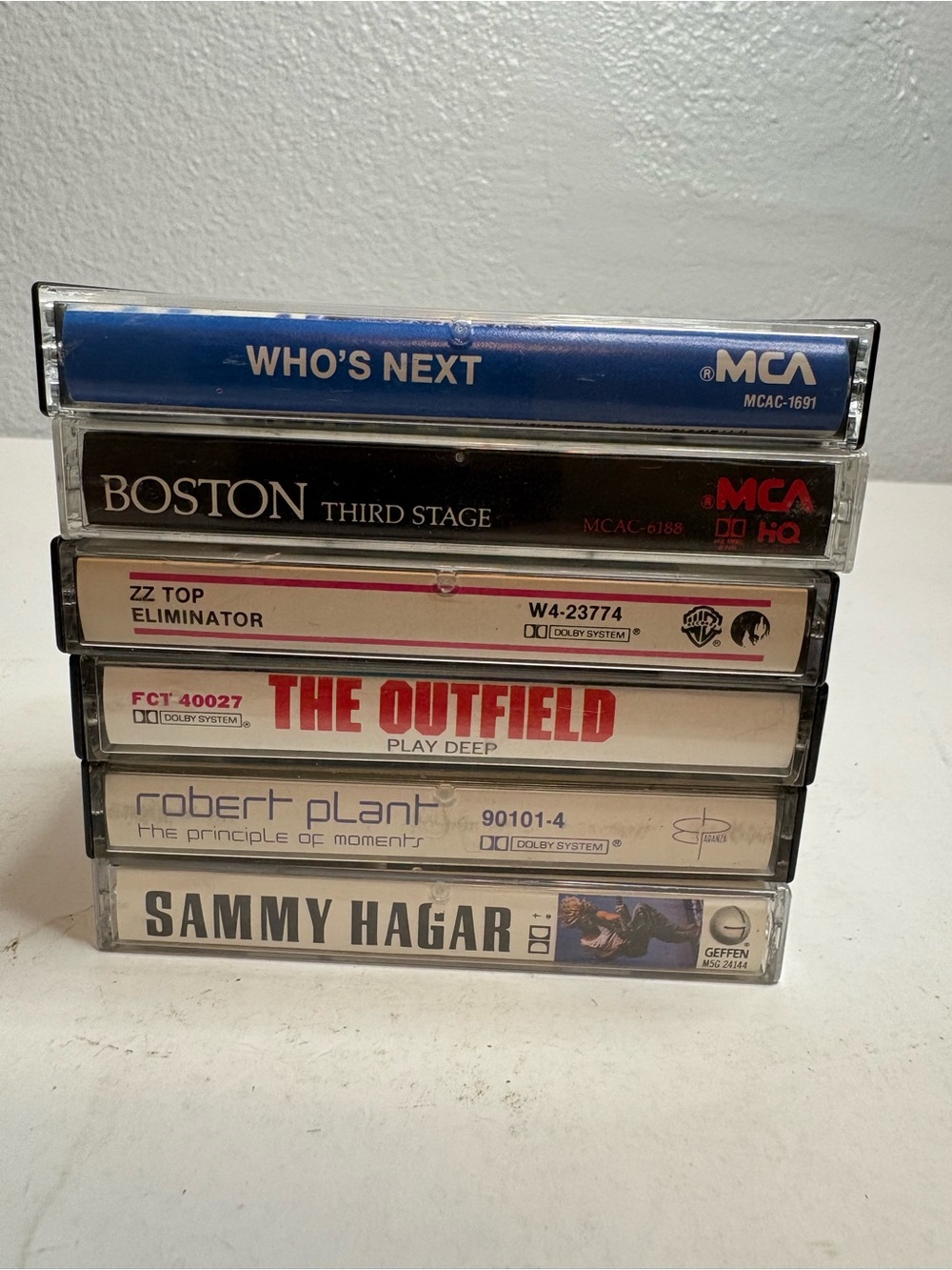 Stack of Cassette Tapes with MCA and Artist Labels - Blue, Black, White